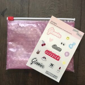 Glossier stickers and makeup pouch